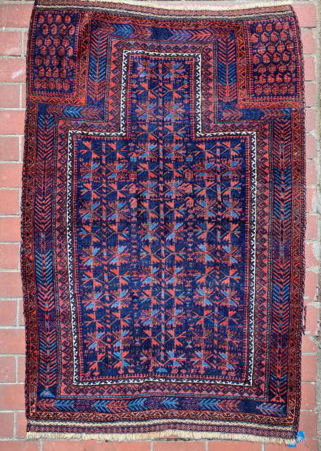 Baluch prayer rug.  19th century. Large and with electric light blues.  Complete and in very good condition. Size: 65 x 40 inches.         