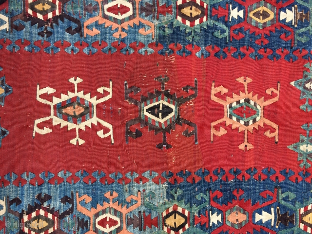 Detail of a small Western Anatolian kilim.  The colors are deeply saturated and it looks to be from the 1st half the 19th century. There is an inscription that looks like  ...