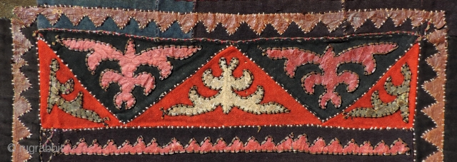 Khirgiz appliqué hanging.  Older than most, this unusual piece has seven different colors of dyed leather used in the appliqué.  It also uses old trade cloth in both wool and  ...