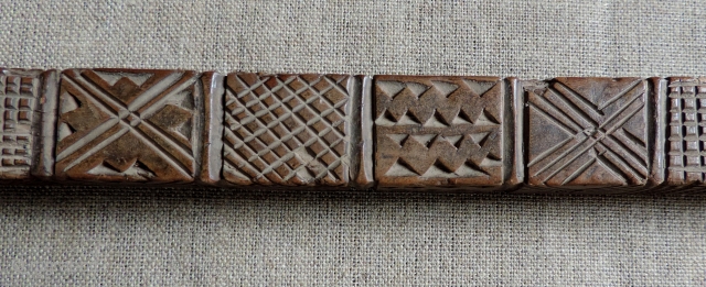 Albanian distaffs and other carved wooden weaving implements.  19th century. longest piece 37 x 4 inches.                