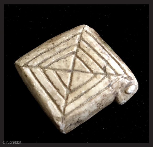 Carved and incised alabaster amulet.  19th century.  Bolivian Altiplano.  This type of fetish is called an illa (ee-ah). It was made in the shape of a generic domestic animal  ...