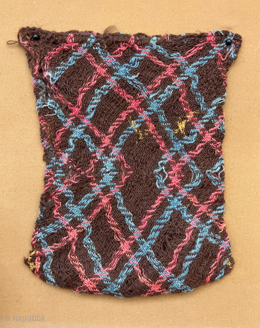 Another two thousand year old bag.  Paracas, South Coast Peru.  Archaic pre-loom technology where design imitates structure.  Size: 8 x 6.5 inches.        