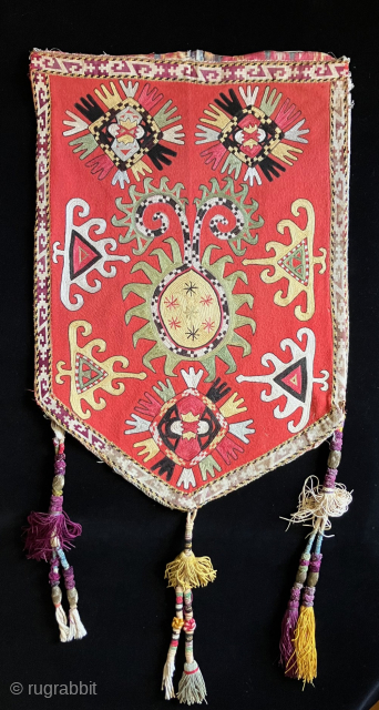 Classic late 19th century Lakai embroidered okbash (kap ilgich) - sometimes referred to as a "shield bag". Very finely worked embroidery and good colors. The tassels were probably added later. Such hangings  ...