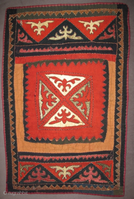 Central Asian Kirghiz small Applique: leather, wool, some metal thread and perhaps cotton on a block-printed back, silk stitching. 24" x 16"           