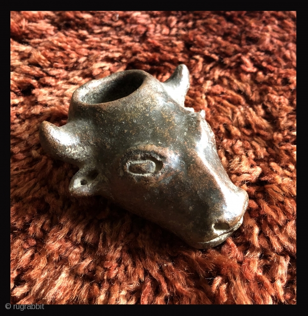 This unusual small cow head shaped ceramic is probably a variant type of libation vessel associated with the Animal Increase Rite.  I have not seen anything quite like it before.   ...