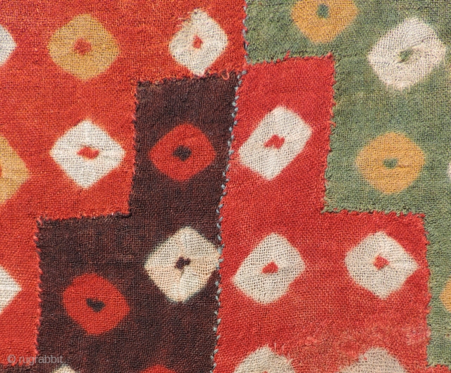 Beautiful, small Pre-Columbian tie-dyed textile. This is a very colorful and enduring object of ancient textile art dating from a.d. 400 - 800. It has been conserved to a neutral linen backing  ...