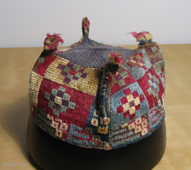 Of all the Wari pile hats I've had over the years this simple stepped diamond designed example remains among my personal favorites. This textile is all about the color and the fiber.  ...