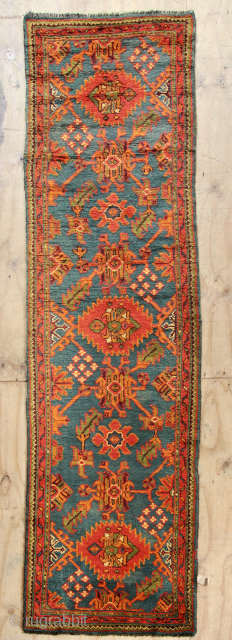Long narrow blue Oushak runner circa 1900. 3'2" x 11'11" in great condition.                    