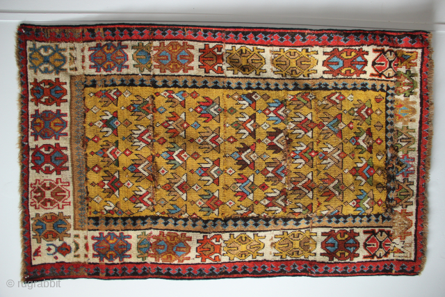 Richly coloured North West Persian rug fragment- actually many fragments, loosely sewn together. Circa 1860. 2'11" x 4'9" / 90 x 145cm           