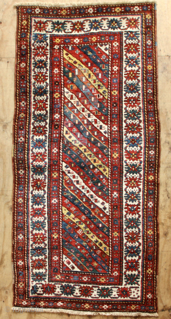 Very fine Kazak in full pile one with large repair that has slightly faded. Beautiful wool and dyes. 3'7" x 7'            