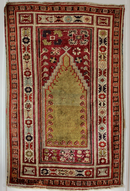 Antique Kirsehir prayer rug circa 1850. In decent pile with a few old repairs, corrosion to black. Would respond well to a deep clean. 3'8" x 5'11" / 112 x 181cm  