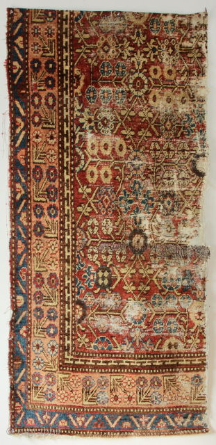 Early 19th century Khotan carpet fragment. Has glue on the back. 2'6" x 5'6" / 76 x 169cm               