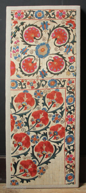 Mid 19th century Nurata Suzani fragment, beautifully mounted.
39 x 95cm / 1'3" x 3'1"                   