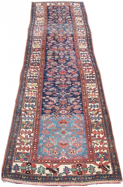 Kurdish runner, blue field displaying pleasing wool batch colour change arbrash effect decorated with the herati design, ivory framing main border, single woolen wefts, c1920s/1930s (80 years old approx) 395 x 107cm;  ...