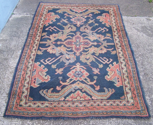 Ushak Oushak rug, fairly 'late' example with blue ground, some wear, some colour fading.                   