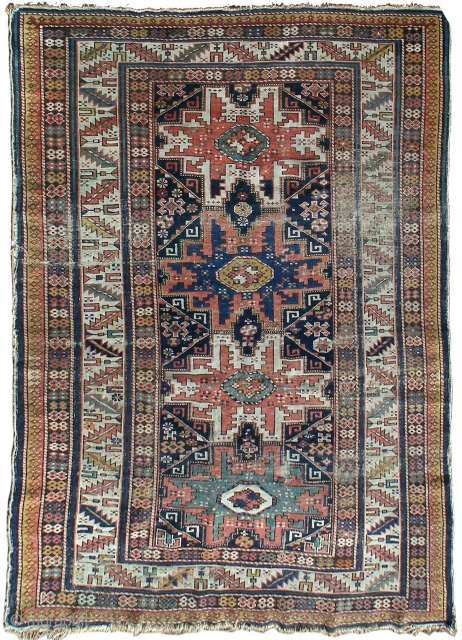 Shirvan rug, with column of four 'Lesghi' stars enclosed by ivory leaf-and-calyx border, cotton wefts, wool warps, very occasional synthetic orange (2 locations only approx -see detail image) in border, colours appear  ...