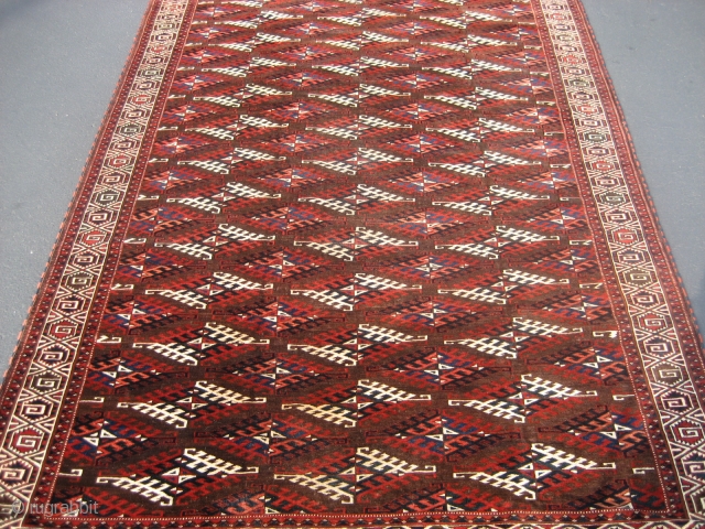 Yomut Main Carpet 6' 9" x 11' 4"

Probably 1920's or 30's. Great decorative piece in good condition.  Some areas of lower pile, but no foundation showing.  Edges and ends are  ...