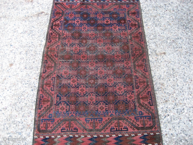 Belouch 3' 3" x 5' 5".
Probably circa 1920 or earlier.  Even low pile with the usual corrosion in the brown (see photos).  The glory of this little rug is the  ...