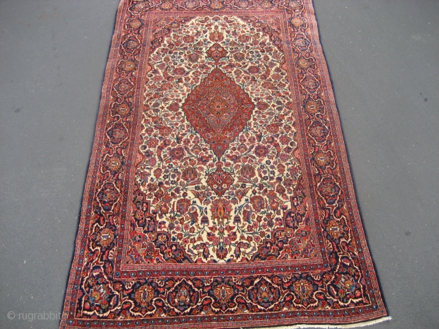 Kashan rug, 4' 3" X 7' 2", probably circa 1920-1930.  Scarce ivory ground.  Even low to slightly better pile all over.  My restorer added new edge wrapping and other  ...