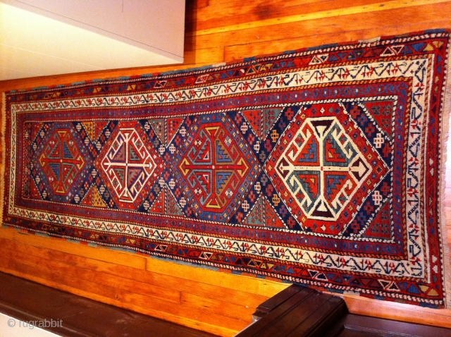 1890's Schulaver Kazak long rug, 7'7"x2'7".  

This rug has lovely vegetable dyed colors and is in very good condition. There have been repairs done, but the work is excellent and difficult  ...