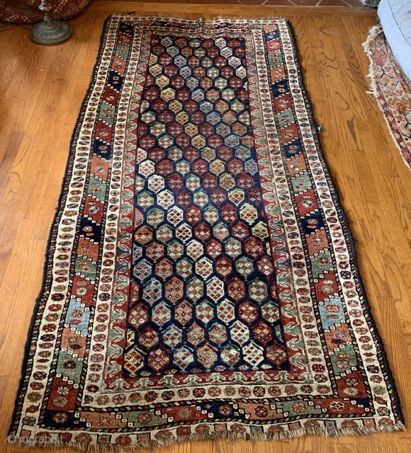 Botehs for days and days on this brightly colored 19th Ca Luri rug!

Measuring 7'10"x3'9" the rug shows signs of wear in some areas.  Repairs to selvages only.  Tear in one  ...