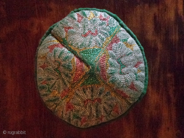 old hat from the border of Afghanistan and Pakistan . . . hand made .  colored metallic thread .             