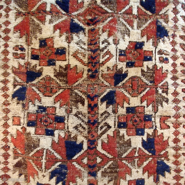 Antique Baluch prayer rug. Glossy camel field with saturated madder red in high relief, deep indigo highlights, and heavily oxidized browns, combining to form a rug of striking, sculpted presence.  Displays  ...