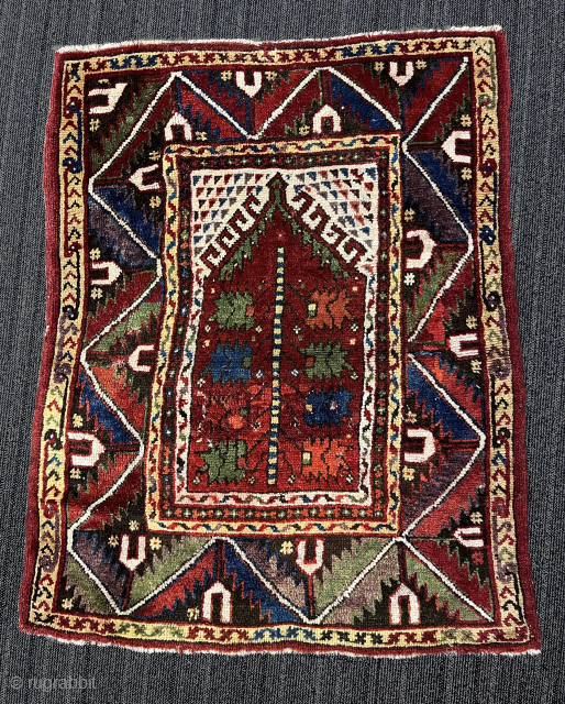 Crippled late 19th century, West Anatolian prayer rug. 3' x 4' (90cm x 120cm). A few darned holes and other repairs as evidenced by the expandable photos. A bit of fucsine. $200 ...