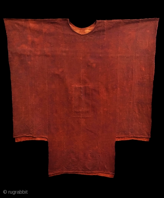 West African kola-dyed, cotton tunic, probably from Mali. Mid 20th C?   Composed of narrow woven bands hand-stitched into a fabric.  For reference see "Mali Mud Clothes", in AFRICAN TEXTILES,  ...