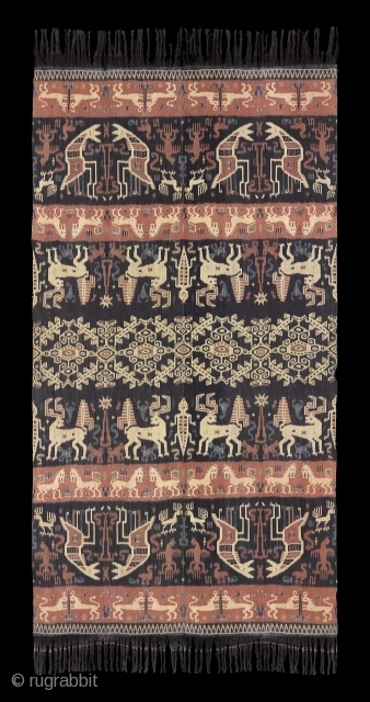 TE02377

1940s Hinggi Kombu, man's ceremonial shoulder wrap, cotton alternating orange and dark brown bands with warp Ikat rows of animals and sea creatures and a large patola ratu band in center. Natural  ...