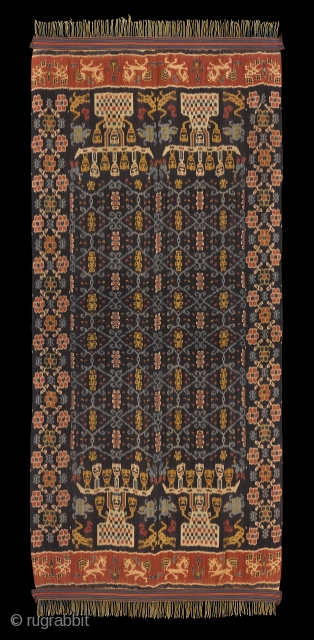 TE02378

1970s  Hinggi Kombu, man's ceremonial shoulder wrap, cotton large warp Ikat patola ratu central field flanked at top and bottom by two andong trees on each side.  Long sides are  ...