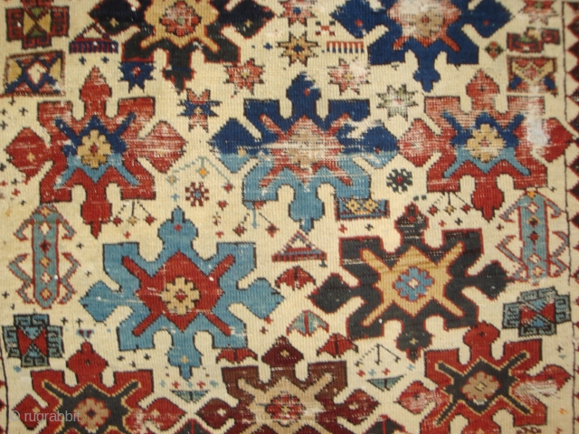 Shirvan 15 Snowflake Stars on Ivory. A 19th century prayer rug of petite dimensions. Camel hair and wool, some cotton weft. Numerous small holes and nicks, no restorations. A battle-scarred veteran of  ...