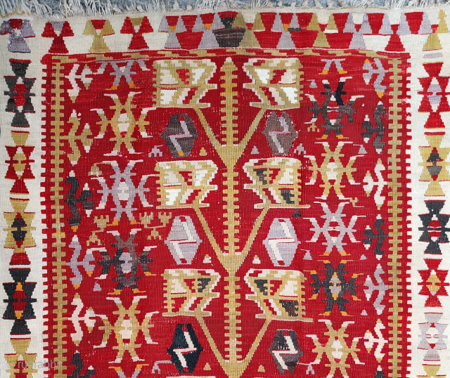 Mid-20th century Anatolian small Tree kilim, 3'2" x 4'6". Robust yellow gold Tree with 5 pairs of geometrically stylized leaves, each containing 5 smaller leaf forms, on a deep crimson field. Broad  ...