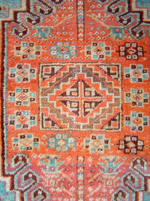 Sparkling little Anatolian yastik with rare gul and a mini=prayer design. Both madder and cochineal reds. Luminous silky angora-like wool. One end reduced, and so is the price.     