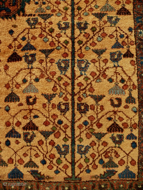 Early 20th century Afshar rug, 1.75 x 1.45m. Unusual in the absence of corner elements; very beautiful tree-of-life motif with birds and hanging flowers. Good pile; natural dyes, with golden yellow field.  ...