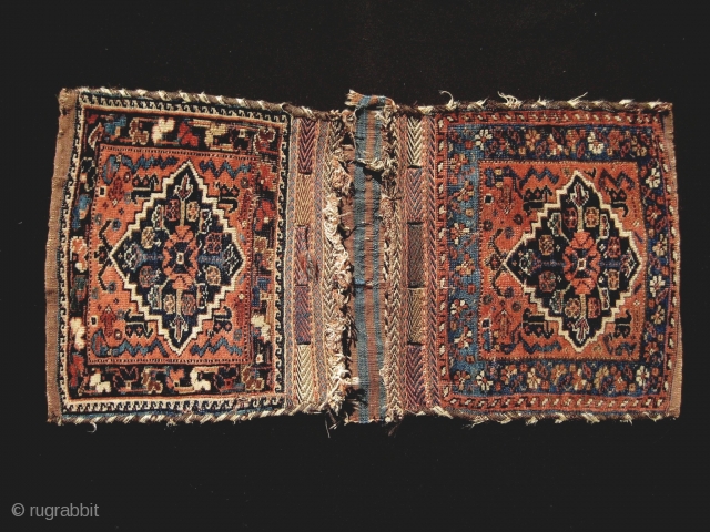 Finely woven Afshar khorjin, probably older than usual. Some wear and damage, but a graceful and restrained example.               