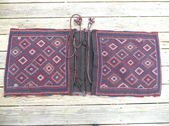 Antique Caucasian Flatwoven Saddle bags (Complete)
Circa 1900
Plain weave with extra weft wrapping
Similiar to technique of #77 "From Bosporas to Sanmarkand Flatwoven Rugs"
Only repairs are in the flatwoven breidge between the bags.  