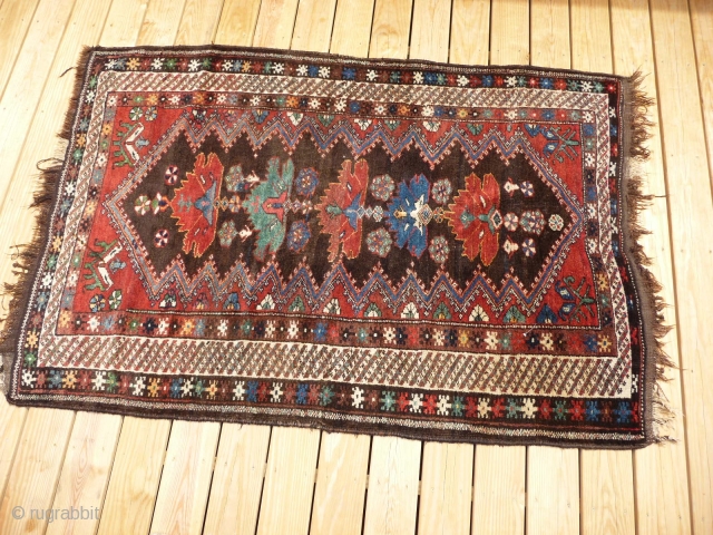 Circa 1900 kurdish rug
6ft 5ins x 4ft 5ins
Full piled minor 6 inch x 1/4 inch lower dipe at end of rug
Also has 1 inch patch.
        