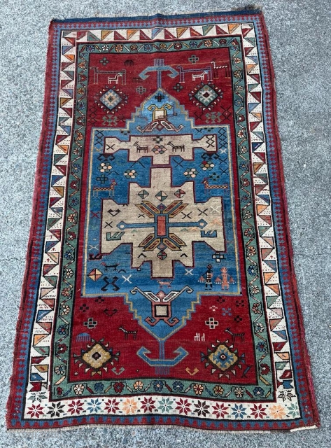 Caucasian Kazak, Early 20th Century, 4' 7" x 6' 4", some repairs.                     