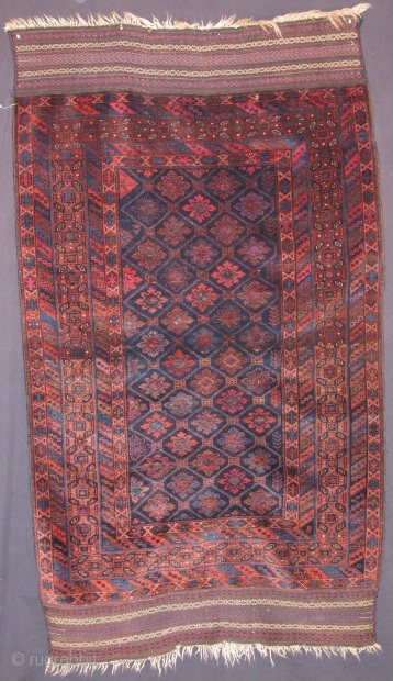 antique Baluch rug, Northest Peersian (Khorrosan), silky lustrous wool that shines. Good complete condition. There is cochineal in this piece along with three very small highlights with fuchsine  in the striped  ...