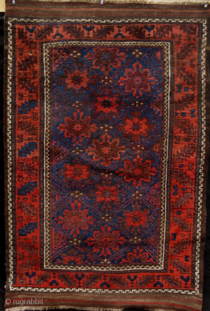 Superbly executed Northeast Persian Belouch Rug from the turn of the 19th century
with lustrous blues, an animated main field, and a crisply articulated design.
(3' x 4'8")
       