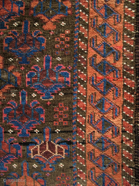 Symmetrically knotted Baluch rug, of the type now often called Bahluli. Very good color on a brown ground with Dokhtar-i Gazi shrubs and a border often seen in some Turkmen rugs.
(3'9" x  ...