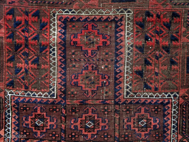 Belouch Prayer rug from the turn of the 19th century with a compartmentalized
cruciform design. (2'10" x 4'2")                