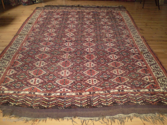 A fine, old Chodor 'Ertmen-gul' main carpet, Turkmenistan, probably mid 19th century.   355 x 235cm (11ft 8in x 7ft 8in).   Wonderful colours, lots of pile, but also uneven  ...