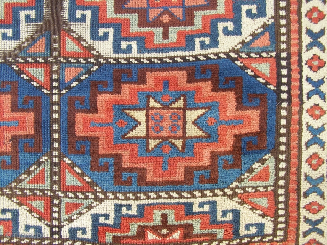 An East Anatolian 'Memling Gul' rug, probably mid 19th century, 245 x 111cm.  Deep, saturated colours.  Corroded brown and some damage.   Feels early.      