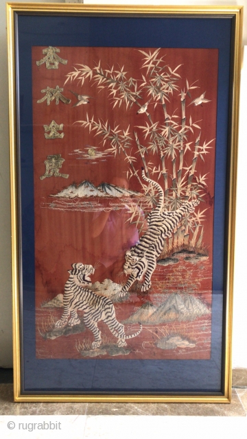 In the Qing Dynasty, the red satin land was embroidered with tiger down the mountain, while the red land was embroidered with mountain, bamboo forest, tiger, bird and other things. In the  ...