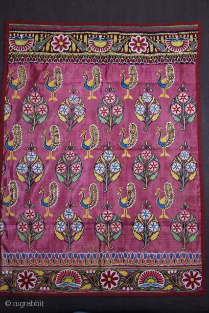 A fine piece of Mochi embroidery textile on maroon satin silk decorated with typical peacock and floral motifs.               