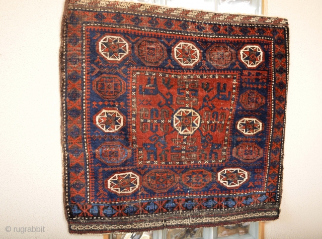 Beautiful 1880's Pinwheel Border Baluch Bagface, Goodsaturated colors Electric Blue Pinwheels with 8 white stars.. Orginal Kilim ends, 
Telling a Bigstory Patern Check and see:)
 Coroded Black/Brown 
size 84 x 79 centimeters 