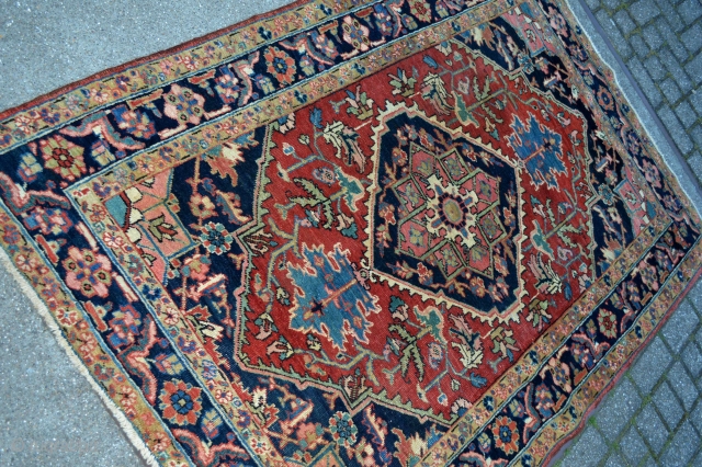 This lovely little rug from Heriz in north west persia was made in the first quarter from the 20 century circa 1900-1920.Good pile some low spots. not worn.Good natural colors. Rare in  ...