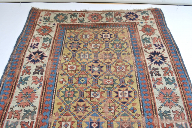 Beautiful Antique Caucasian rug 
All wonderful natural colours with bright yellow underground … pre 1850s worn and wear areas due his great age… ready to enjoy on your wall    